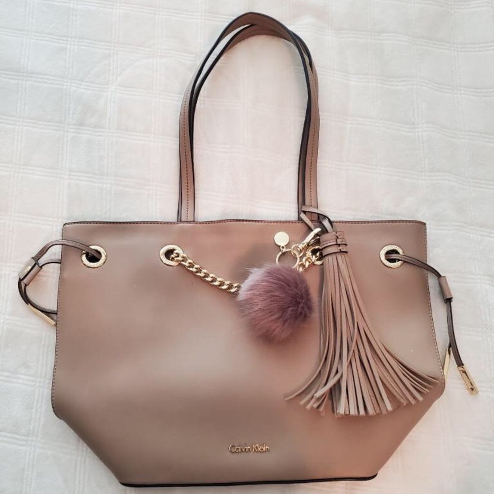 NWOT Calvin Klein tote with tassel and bonus keychain pouf